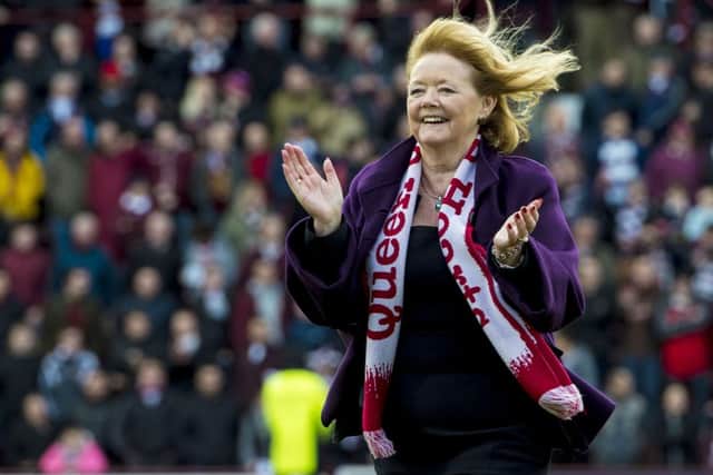 Hearts owner Ann Budge makes her way across the pitch at full-time. Picture: SNS