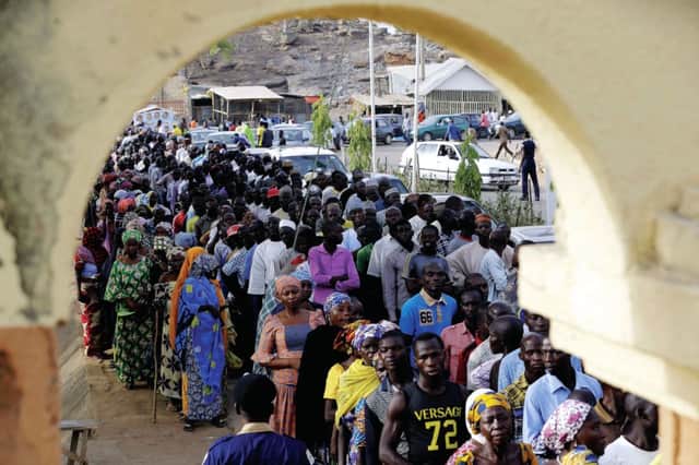 People displaced by militant Islamist attacks queue to cast their vote in Yola, eastern Nigeria. Picture: AP