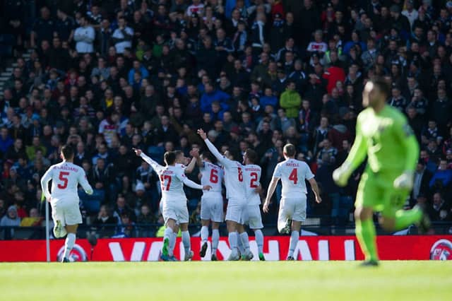 Gibraltar celebrate their first ever competitive international goal. Picture: John Devlin