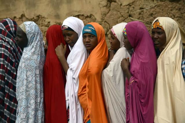 Women wait in line to cast their votes at a polling station in Daura. Picture: AFP/Getty