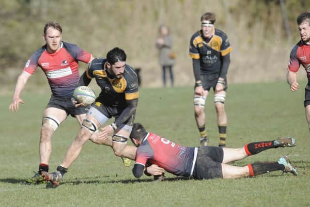 Currie's Travis Brooke is stopped in his tracks by Paddy Boyer. Picture: Greg Macvean