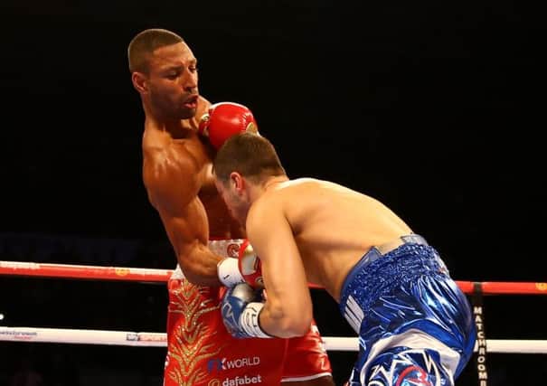 Kell Brook lands a punch on Jo Jo Dan during their world title bout. Picture: Getty