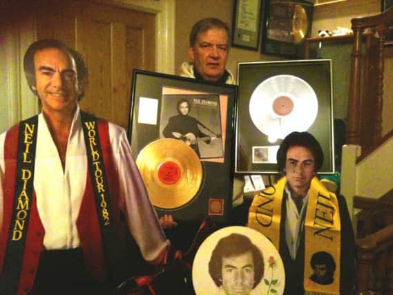 Ian Graham with some of his memorabilia at his home in Edinburgh as he prepares to follow Neil Diamond to 18 concerts across Europe and two in the US in 2015. Picture: PA