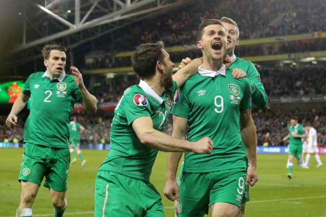 Republic of Ireland's Shane Long (right) celebrates his last-gasp goal. Picture: PA