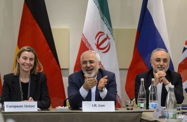 Federica Mogherini with Mohammad Javad Zarif and Ali Akbar Salehi at Lausanne. Picture: AFP/Getty