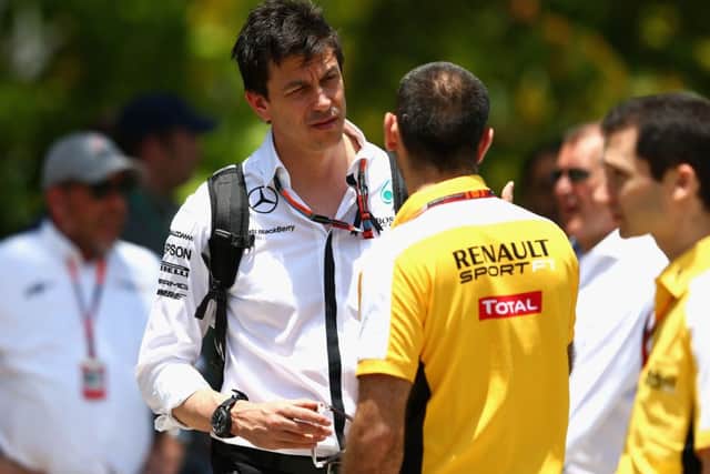 Mercedes chief Toto Wolff in discussion with Renault's Cyril Abiteboul in Kuala Lumpur. Picture: Getty