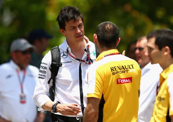 Mercedes chief Toto Wolff in discussion with Renault's Cyril Abiteboul in Kuala Lumpur. Picture: Getty
