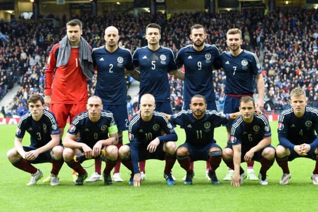 Russell Martin (back row, centre) was the only recognised centre back in the team. Picture: SNS