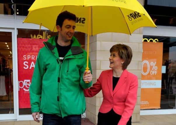 Nicola Sturgeon meets 6ft 5in SNP voter John McKenzie on the campaign trail. Picture: Hemedia