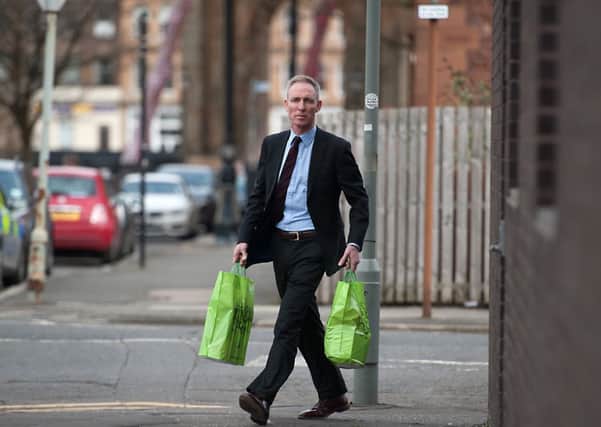 Jim Murphy takes supplies to a food bank in the Gorbals. Picture: John Devlin