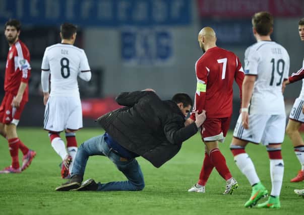 A fan runs on the pitch during the Euro 2016 Group D Qualifier match between Georgia and Germany at Boris Paichadze Stadium in Tbilisi, Georgia. Picture: Getty