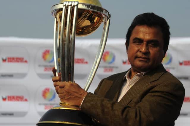 Mustafa Kamal with the World Cup trophy he was prevented from presenting. Picture: AFP