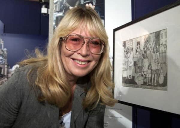 John Lennon's first wife Cynthia, with one of her drawings, as she has died today at her home in Spain. Picture: PA
