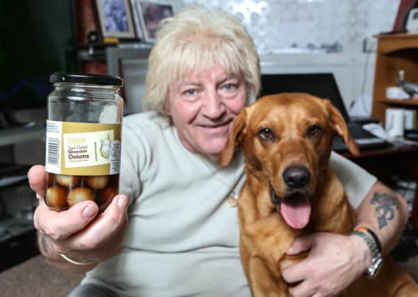 Alan Spencer with his dog Lexi, who saved his life by jumping on his back when he passed out after choking on a pickled onion. Picture: SWNS