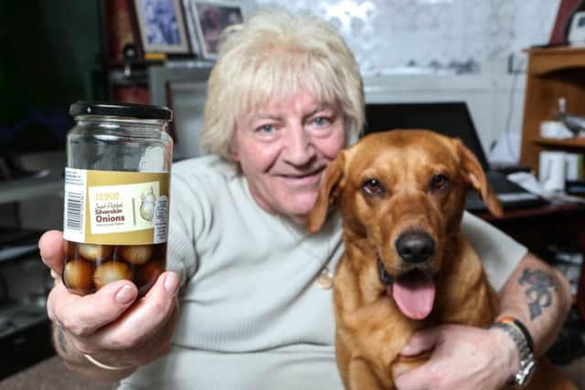 Alan Spencer with his dog Lexi, who saved his life by jumping on his back when he passed out after choking on a pickled onion. Picture: SWNS