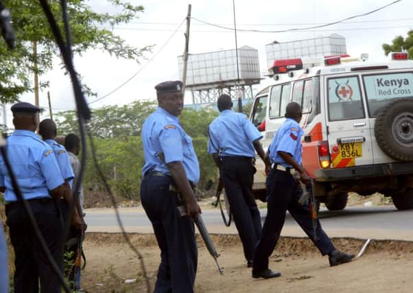 Kenyan police officers take positions outside the Garissa University College. Picture: AP