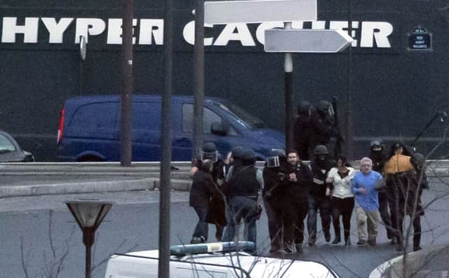 Media coverage of the siege of the kosher supermarket in Paris 'put hostages lives in danger'. Picture: AP
