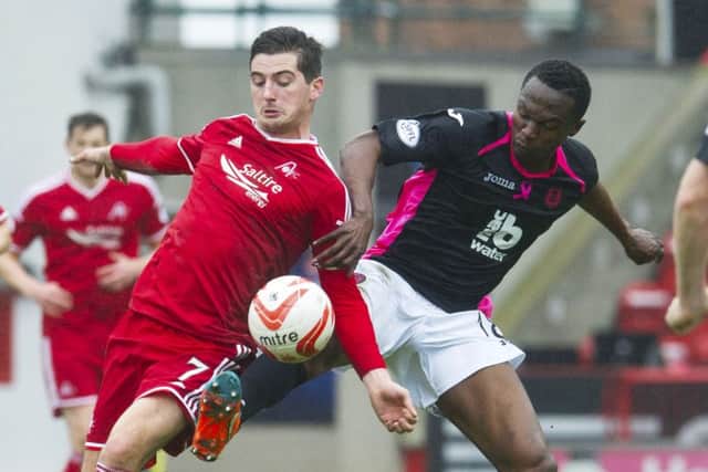 Kenny McLean (left) battles with Abdul Osman. Picture: SNS