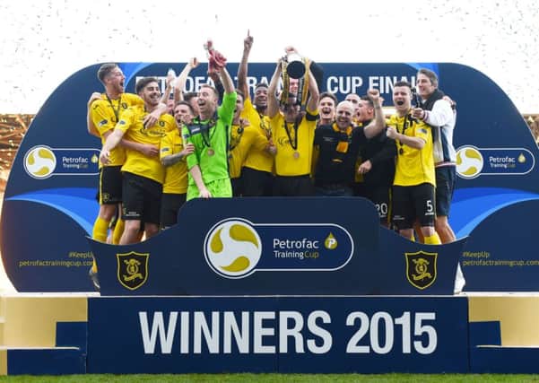 The Livingston players celebrate after wining the Petrofac Training Cup. Picture: SNS