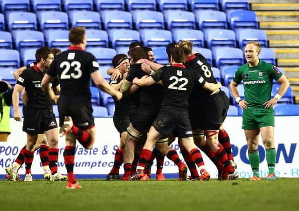 Edinburgh players celebrate after repelling a late London Irish drive and progressing to the Challenge Cup semi-final. Picture: Ben Hoskins/Getty