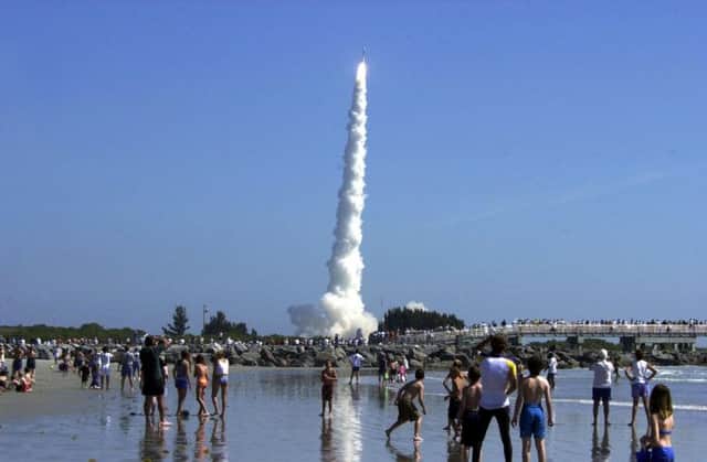 People gather to watch Delta II rocket launch the Mars Odyssey from Cape Canaveral in Florida. Picture: AFP/Getty