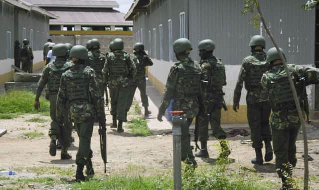 Soldiers from the Kenya Defence Forces patrol inside the Garissa University College compound yesterday. Picture: AP