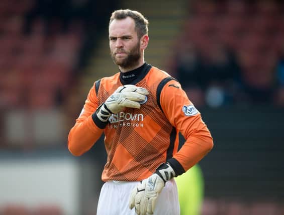 Goalkeeper Alan Mannus, who has signed a new deal with St Johnstone, expects a hard game in Dingwall. Picture: SNS