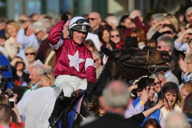 Katie Walsh celebrates after guiding Thunder And Roses to victory. Picture: PA