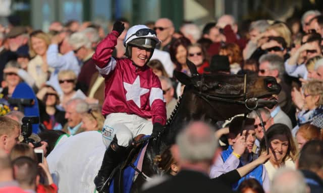 Katie Walsh celebrates after guiding Thunder And Roses to victory. Picture: PA