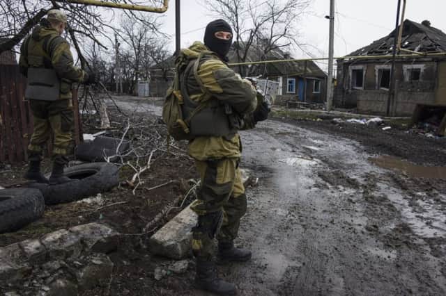 Russian-backed rebels take up position outside Donetsk in eastern Ukraine earlier this month. Picture: AP