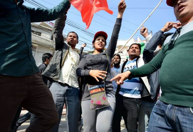 Supporters of the 30-party alliance led by the Unified Communist Party of Nepal shout slogans. Picture: AFP/Getty