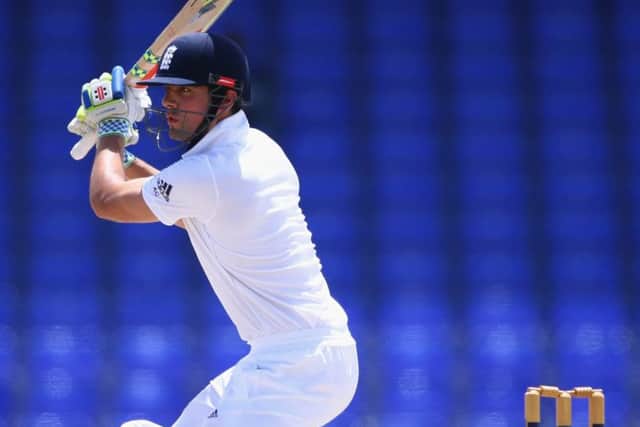 Alastair Cook hits through the offside on his way to 101 in England's opening tour match. Picture: Getty