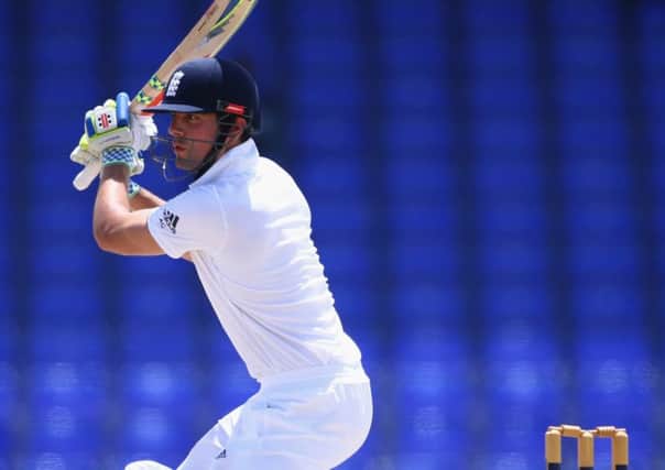 Alastair Cook hits through the offside on his way to 101 in England's opening tour match. Picture: Getty