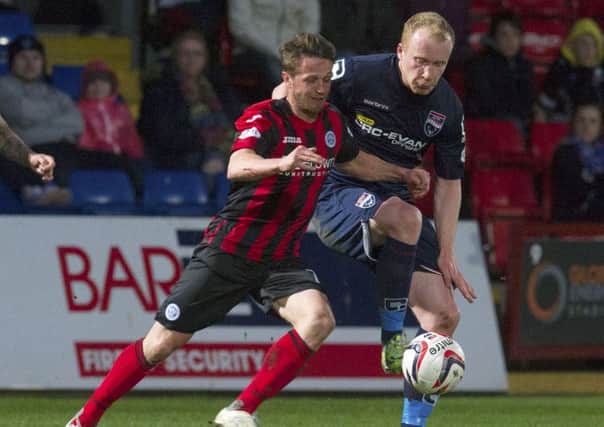Chris Millar (left) challenges Ross County's Liam Boyce. Picture: SNS