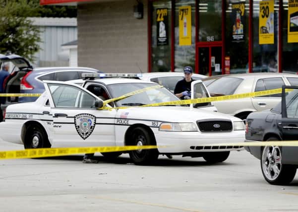 Investigators collect evidence at the scene in North Charleston. Picture: AP