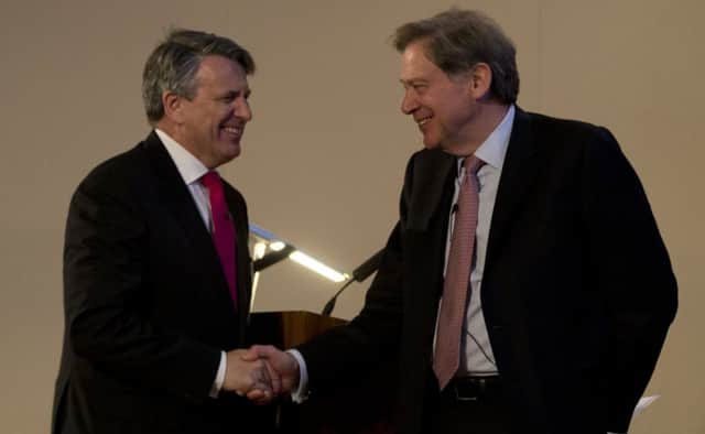 Royal Dutch Shell chief executive Ben van Beurden, left, shakes hands with the chairman of GB group Andrew Gould. Picture: AP