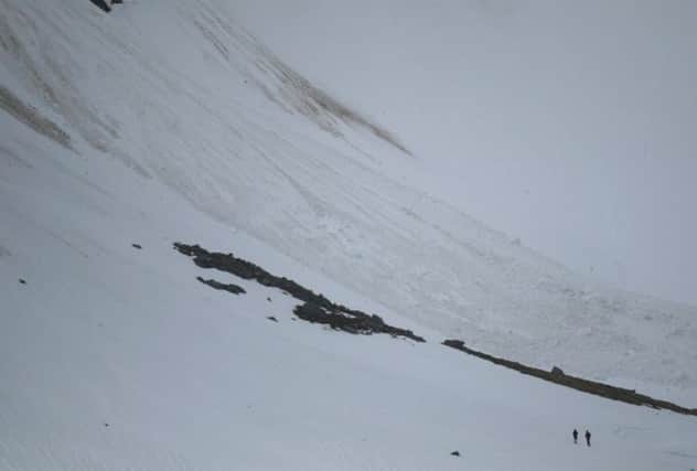 The two 'tourists' can be seen at the bottom of this picture approaching the avalanche. Picture: SAIS Creag Meagaidh Blog