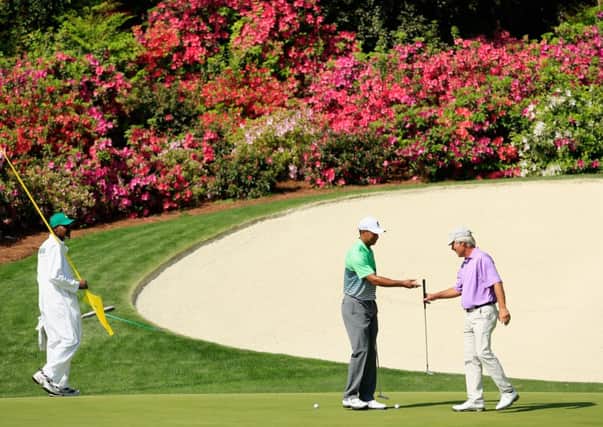 Four-times champion Tiger Woods, left, and Ben Crenshaw, twice a winner of the Green Jacket. Picture: Getty