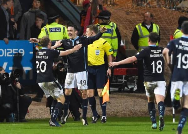 Dundee striker Paul Heffernan (2nd from left) celebrates his goal with his team-mates. Picture: SNS