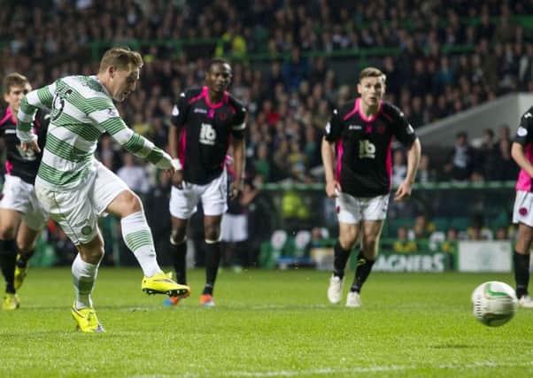 Celtic star Kris Commons fires the ball into the net from the penalty spot to give his side the lead. Picture:SNS