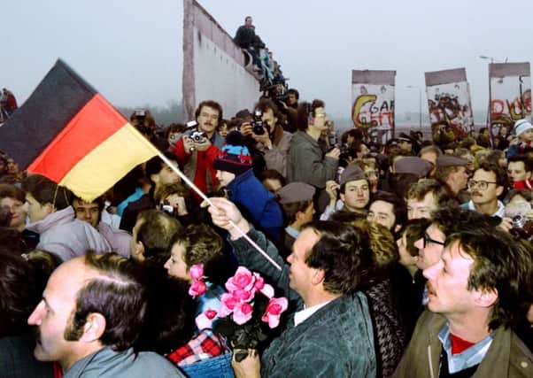 The slogan We are the people helped bring down the Berlin Wall in 1989. Picture: Getty