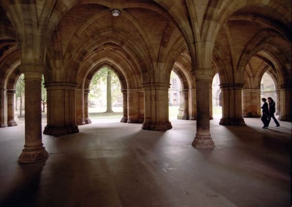 Students walk through Glasgow University's famous cloisters. Picture: Robert Perry