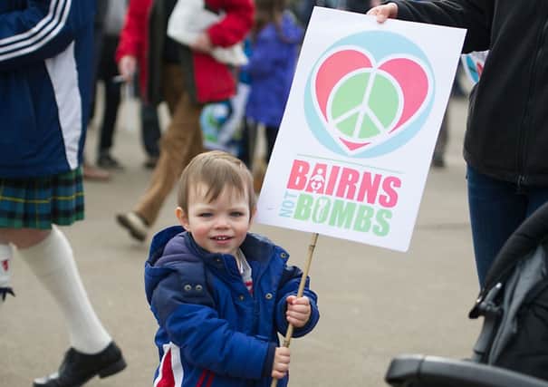 A young anti-Trident protester at a demo in Glasgow. Picture: John Devlin