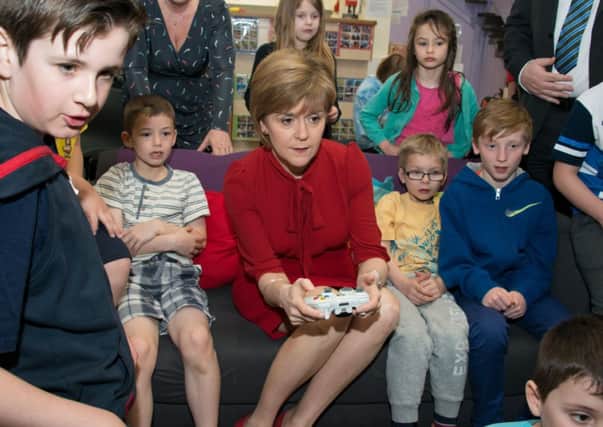 Nicola Sturgeon visited an after-school club in Loanhead yesterday. Picture: Andrew O'Brien