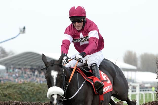 Don Cossack, ridden by Tony McCoy, on his way to winning the Betfred Melling Chase. Picture: PA