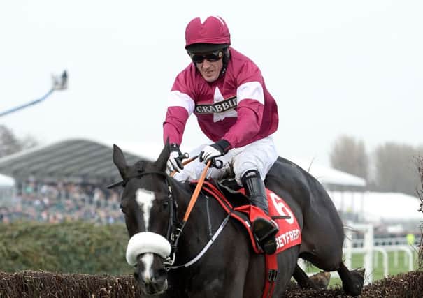 Don Cossack, ridden by Tony McCoy, on his way to winning the Betfred Melling Chase. Picture: PA