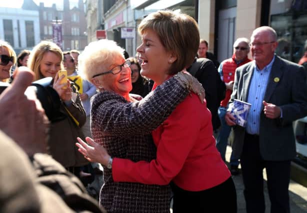 Nicola Sturgeon is hugged by a supporter in Stirling. Picture: PA