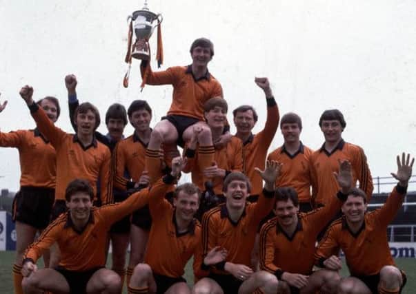 Hegarty celebrates Dundee United's league championship in 1983. Picture: SNS