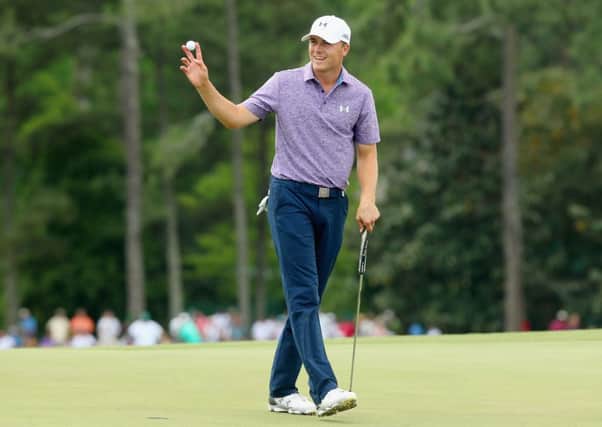 Jordan Spieth waves to the gallery on the 18th after a six-under par 66. Picture: Getty