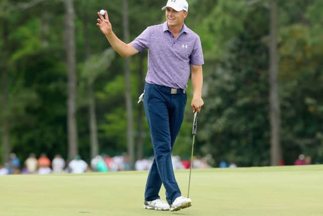 Jordan Spieth waves to the gallery on the 18th after a six-under par 66. Picture: Getty
